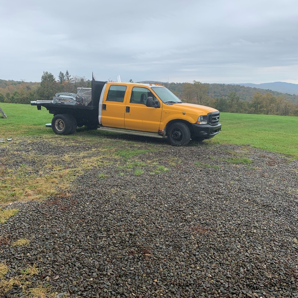 2004 turbo diesel Four-door flatbed with gooseneck foldaway hideaway ball.